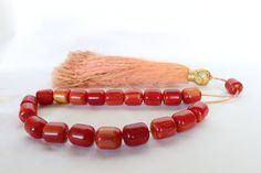 "🌍✈️ Free Worldwide Shipping via DHL EXPRESS on all orders! 🎁📦 Antique Bakelite Worry Beads with Silk Tassel, Prayer Beads, Meditation Beads, Greek Komboloi, Large Bakelite Prayer Beads Unique Home Decor 🖋️ Here we present to you a truly magnificent piece of antiquity and more specifically a vintage handmade, highly collectible, Greek traditional Komboloi(Prayer Beads/Worry Beads), back from the 60's. It is completely handmade of 19+1 Bakelite cylinder shaped beads in a magnificent red color Large Orange Beads For Crafting, Orange Large Beads For Crafting, Spiritual Large Red Beads, Red 8mm Spiritual Beads, Adjustable Red Large Beads, Bohemian Red Hand-strung Beads, Tibetan Prayer Beads, Greek Tradition, Meditation Beads