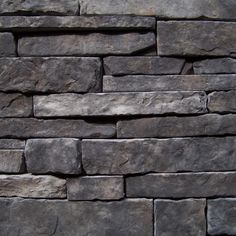 a stone wall is shown in grey tones