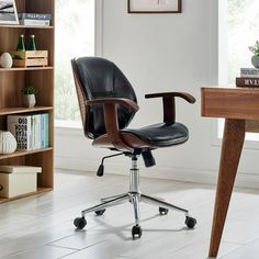 an office chair sitting on top of a wooden desk next to a book shelf and bookshelf