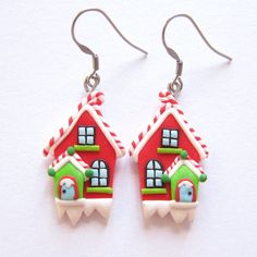 a pair of red and green house shaped earrings on white background with silver ear wires