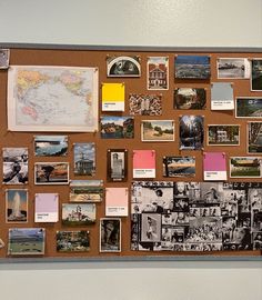 a bulletin board covered in pictures and magnets