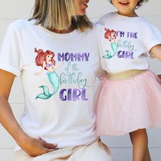 two girls wearing matching shirts with the words mommy of the birthday girl printed on them