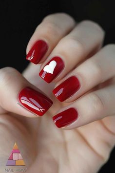 These glossy red nails with a white heart accent are perfect for a romantic and chic fall look. The simple yet striking design makes it ideal for any occasion. Find more beautiful nail ideas at NailHow.com and save this pin for your next manicure! Red Heart Manicure, Iconic Red Lipstick, Red Summer Nails, Bright Red Nails, Silk Wrap Nails, Red Manicure, Nail Prices, Sns Nails, Nail Oil