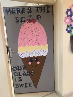 a door decorated with an ice cream sundae and cherry on top that says, here's the scoop our class is sweet