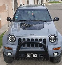 the jeep is parked on the side of the road