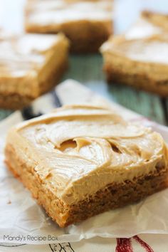 peanut butter bars sitting on top of white paper