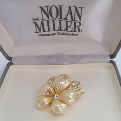 Vintage Nolan Miller Brooch Lucite Flower Petals  Clear Color Crystals Glamour Collection in Original Box.Stunning, elegant, multileveled design with high-quality, exceptional crystals. A luxurious, high-end, designer piece in an original box with all the original certificates. In pristine pre-owned condition. For new arrivals check out the store's Instagram account https://www.instagram.com/helensjewellerybox/ Thank you for looking and if you have any questions please don't hesitate to ask :) All jewellery is photographed in natural light and may have light scratches due to age and wear* Luxury Elegant Lucite Jewelry, Luxury White Flower Brooch, Nolan Miller, Color Crystal, Flower Petals, Instagram Account, Natural Light, Brooch Pin, Brooches