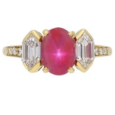 Vintage star ruby and diamond ring by Tiffany & Co. Set centrally with an oval cabochon natural unenhanced Burmese star ruby in an open back claw setting with an approximate weight of 2.47 carats, flanked by two hexagonal step cut diamonds in open back rubover settings with a combined weight of 0.80 carats and further enhanced by six round brilliant cut diamonds in open back grain settings with a combined weight of 0.12 carats. The total approximate diamond weight is 0.92 carats, to a fancy thre Tiffany Engagement Ring, Yellow Diamond Ring, Diamond Gold Ring, Ruby And Diamond Ring, Asscher Cut Diamond, Gem Diamonds, Platinum Diamond Rings, Vintage Star, Victorian Rings