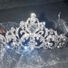 Bejeweled, Silver In Color Tiara/Crown Purchased On Etsy.Com Through Bellatiara For $140 Received A Different One Than Ordered! Sent To Me Missing A Gem, But Will Be Enclosed In Tiara Bag! Easy Fix! Never Worn, Never Used Brand New!!! Stunning For A Wedding, Quinceanera, Sweet 16, Pageants, Cosplays, & More! Don’t Miss Out On This Gorgeous Piece!! Silver Tiara Aesthetic, Silver Quince Crown, Silver Crowns, Crowns Quinceanera, Quincera Crown, Lilac Quinceanera Crown, Silver Crown Quinceanera, Crown Silver, Cinderella Tiara