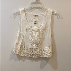 Embroidered White Crop Top Size: Small New With Tag! Summer Embroidered Lace Top With Lace Trim, Summer Beach Embroidered Top With Lace Trim, Summer White Tops With Intricate Embroidery, White Tops With Intricate Embroidery For Summer, Casual Fitted Embroidered Top With Intricate Embroidery, Fitted Casual Top With Intricate Embroidery, Casual Summer Tops With Intricate Embroidery, Casual Embroidered Top With Intricate Embroidery For Spring, Sleeveless Top With Intricate Embroidery For Spring