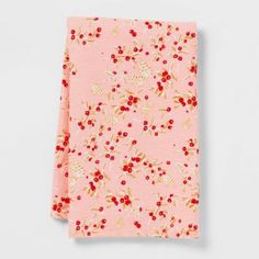 a pink floral print pocket square on a white background