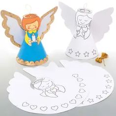 two paper angel cutouts next to each other