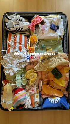 an open suitcase filled with clothing and shoes