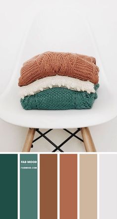 a white chair with some sweaters on it and color swatches in the background