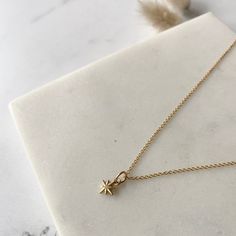 These little North Star pendants are an ideal for layering, or perfect as a minimal everyday necklace.  Pair with other pieces from the celestial collection such as Luna, Crescent Moon and Sunbeam.  Details: W 7mm x L 7mm 14k Gold Vermeil Pendant 14k Gold Fill Chain Choice of Chain Style and Length  Presented in Lovebird Gift Box Everyday Celestial Necklace With Star Charm, Everyday Celestial Star Necklace, Minimalist Star Charm Necklace With Delicate Chain, Dainty Star Charm Necklace For Everyday, Tiny Star Shaped Minimalist Necklaces, Yellow Gold Everyday Charm Necklace With Star Charm, Tiny Star Minimalist Necklaces, Minimalist Tiny Star Necklaces, Minimalist Star-shaped Everyday Jewelry