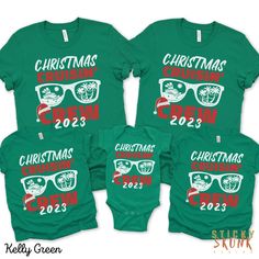 three matching christmas shirts with sunglasses on the front and one in the back, both wearing green