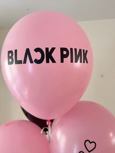 pink balloons with black ink written on them