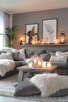 a living room filled with lots of furniture and candles on top of it's coffee table