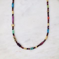 NKL Ferris Wheel Necklace in Gold & Ruby Spiritual Multi-stone Beaded Necklaces As Gifts, Spiritual Multi-stone Beaded Necklace For Gift, Green Multi-stone Beaded Necklace For Gift, Multicolor Spiritual Jewelry With Tiny Beads, Smokey Topaz, Roman Glass, Ruby Sapphire, Silver Accents, 22k Gold