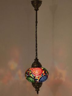 a multicolored lamp hanging from a ceiling