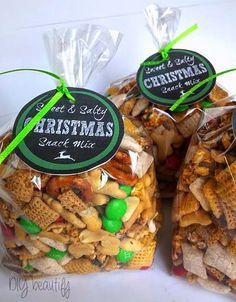 three bags of christmas snack mix sitting next to each other