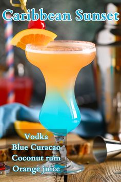 a blue curaco cocktail garnished with an orange slice