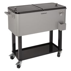 the large cooler is on wheels and has two trays attached to it's sides