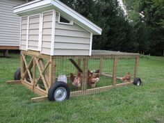 a chicken coop with chickens in it