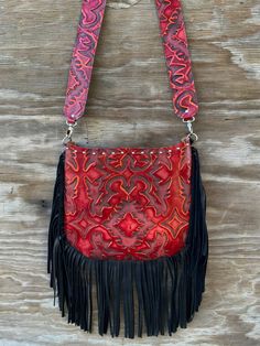 Made of extremely soft genuine leather Leather fringe along the bottom and sides Nail head trim along the top 1 pocket inside - 1 pocket outside Zipper closure for the entire purse 2″ wide leather strap - approx 27″ strap drop Extremely light weight Purse measures approx: 12″ L x 10″ H - laying flat Last photo is for size reference only Red Faux Leather Bags With Adjustable Strap, Red Faux Leather Bag With Adjustable Strap, Red Textured Leather Crossbody Shoulder Bag, Red Leather Crossbody Shoulder Bag, Red Hand Tooled Shoulder Bag For Daily Use, Hand Tooled Red Rectangular Bag, Red Hand-tooled Rectangular Bag, Red Hand Tooled Rectangular Bag, Red Hand Tooled Bag For Daily Use