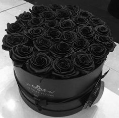 there is a large black box with roses in it