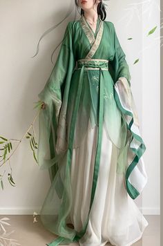 3 Pieces Hanfu Set: Outer layer + Inner Layer + Skirt Embrace timeless beauty with this exquisite green hanfu, a perfect blend of traditional elegance and modern grace. The flowing layers of sheer, lightweight fabric are artfully designed to drape beautifully, creating a sense of ethereal charm. Ideal for cultural events, traditional ceremonies, or as a unique addition to your wardrobe, this hanfu offers a graceful nod to history while ensuring you stand out in any setting. Green Hanfu, Chinese Hanfu Dress, Gaun Abad Pertengahan, Traditional Asian Dress, Fairy Cosplay, Green Bamboo, Old Fashion Dresses, Hanfu Dress, Bamboo Leaves