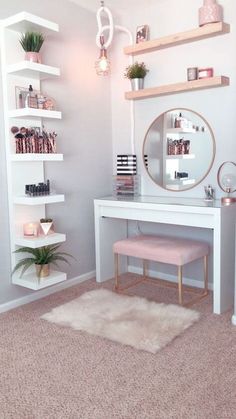 a white desk with shelves and a mirror on it in a room that has pink carpet