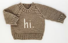 What a fun way to greet the world! Say hi. with our cozy pullover sweater. It has cable trim raglan sleeves with hi. knit into the front in black yarn. The neck is softly knit, making it easy to pull over little heads. Hand-knit in beautiful natural colored yarn, it is soft and warm. This is such a great gender neutral sweater, perfect for any little person. Our sweaters are partially knit from recycled, sustainable Polyester yarn made from plastic bottles. We are on a mission to help reduce the Neutral Sweater, Brown Yarn, Neutral Sweaters, Baby Co, Plastic Pollution, Cozy Pullover, Knit Cap, Polyester Yarn, Chunky Yarn