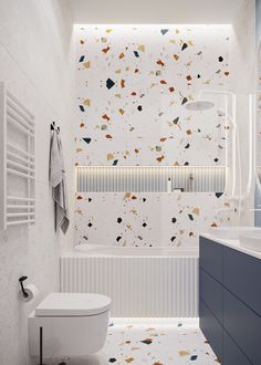 a bathroom with a toilet, sink and bathtub covered in confetti paper