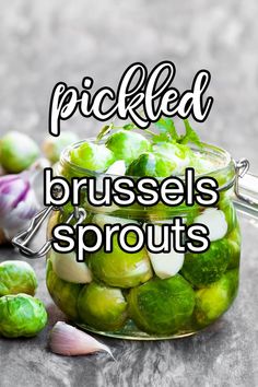 pickled brussel sprouts in a glass jar with the words pickled brussel sprouts