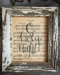 an old wooden frame with sheet music and the words good night written in black ink