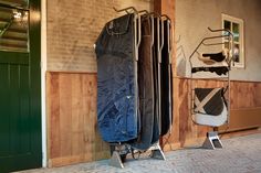 two suit cases are next to each other in front of a wall with wood paneling