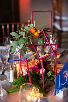 the table is set with candles and flowers