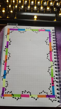 an open notebook with colored lines on it