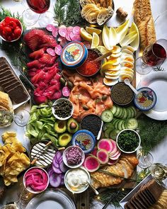 a table topped with lots of different types of food