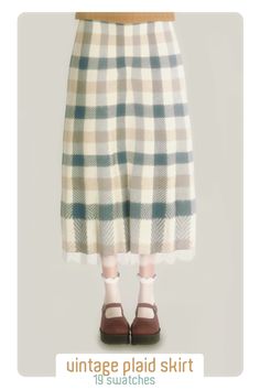 an image of a woman wearing plaid skirt