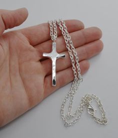 Sterling Hammered Cross Necklace Handmade Wild Prairie Silver Jewelry I hand make and hammer these sterling silver crosses to rustic perfection one at a time in rural Wisconsin. Heavy sterling silver cross with a hammered finish is made to last forever. This beautiful hand made cross Handmade Cross Jewelry For Memorial, Personalized Crucifix Cross Necklace, Adjustable Cross Pendant Necklace, Personalized Silver Cross Necklace, Personalized Memorial Cross Jewelry, Sterling Silver Crosses, Personalized Cross Necklace, Silver Cross Necklace, Sterling Silver Cross Necklace