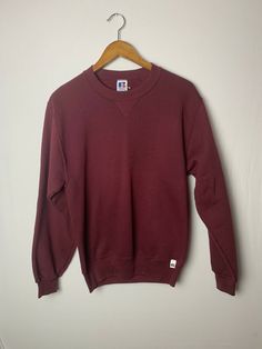 Vtg 90s Russell Athletics Maroon Red Crewneck Sweatshirt Blank Men's Size S.  Nice sweatshirt, no stains or rips, Measurements below.  Will smell dusty from age. Pit to Pit:18 1/4 in Collar to Hem:26  in Sleeve Length: 24 in Inventory c Retro Red Cotton Sweater, Casual Burgundy Crew Neck Sweater, Vintage Red Crew Neck Sweater, Red Vintage Crew Sweater, Casual Burgundy Cotton Sweater, Classic Red Crew Neck Sweatshirt, Red Cotton Crew Sweatshirt, Casual Red Crew Sweatshirt, Red Crew Neck Casual Sweater