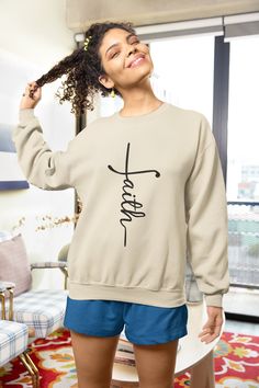 Embrace the powerful message beautifully displayed on this exceptional sweatshirt, which serves as a constant reminder of the strength and love found in your faith. Its unique design showcases a blend of contemporary fashion and timeless spirituality, making it a versatile piece suitable for any occasion. For chilly summer evenings and warm winter layers, sweatshirts are a staple item all year round. The NuBlend® fleece is pre-shrunk, pull-resistant, and quarter-turned so it won't crease in the Winter Layers, Sweat Shirts, Winter Layering, Summer Evening, Contemporary Fashion, Showcase Design, Warm Winter, Crewneck Sweatshirt, Sweat Shirt