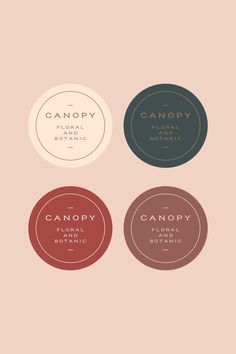 four circular labels with the words canopy, floral botanical and organic on them in different colors