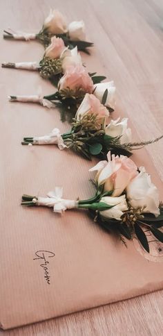 the flowers are lined up on the table ready to be put into the bride's bouquet