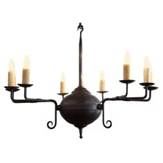 a chandelier with five candles hanging from it's arm and four arms