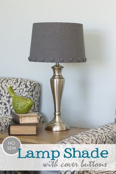 a lamp on a table next to a couch