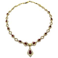 Estate Jewelry Sale: This amazing 18K Yellow Gold Ladies Vintage Ruby & Diamond Necklace literally makes a splash with its flowing raindrop shape that seems to trickle down the neck. It cascades like a fountain of 10.35 carats of diamonds and over 20 carats rubies set in 18k yellow gold. A truly one-of-a-kind diamond necklace for one-of-a-kind lady in your life! Drop width: 15/16 in (23mm), length: 13/16 in (30mm). Ruby Diamond Necklace, Designer Necklace, Jewelry Sale, Yellow Gold Setting, Unique Diamonds, Handcrafted Necklace, Ruby Diamond, Gold Set, Gold Platinum