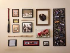 the wall is covered with pictures, baseball bats and other items that are on display